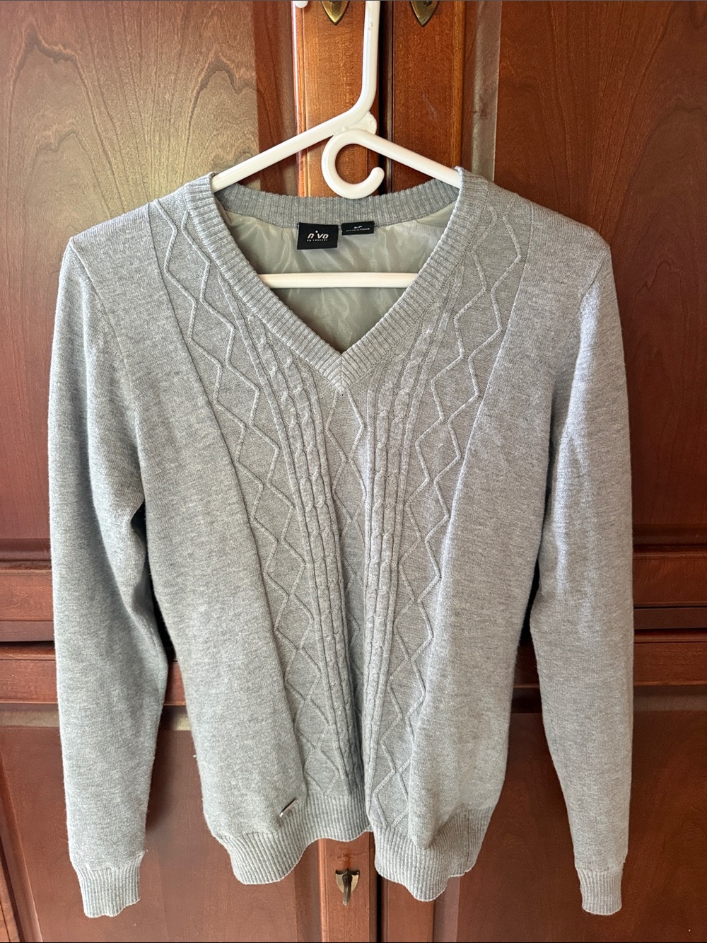NVo Gray Cable V-Neck Golf Sweater by Lanctot. Windproof lining sewn inside.